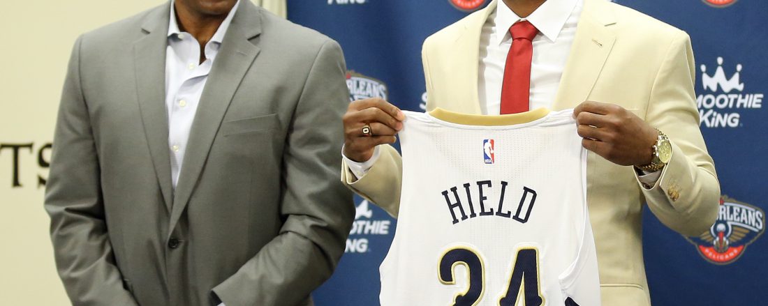 Sixth overall pick Buddy Hield standing with Pelicans' GM Dell Demps at post-draft press conference.